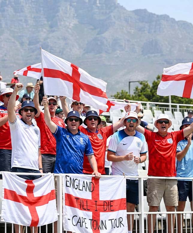 england cricket fans cheering on the team on tour in the sun